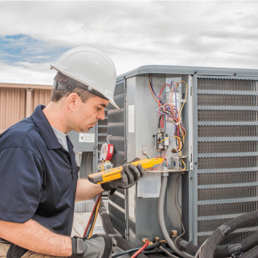 Aylmer Heating & Cooling HVAC technician servicing a system